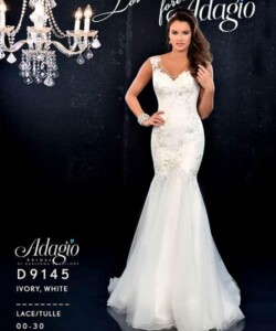 Woman wearing an ivory mermaid-style lace and tulle wedding gown next to a chandelier, with Adagio branding in the background.